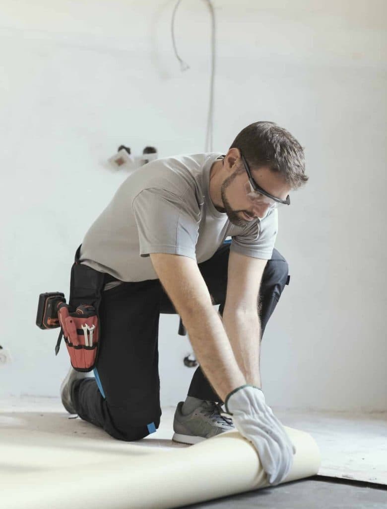 contractor removing an old linoleum flooring.jpg